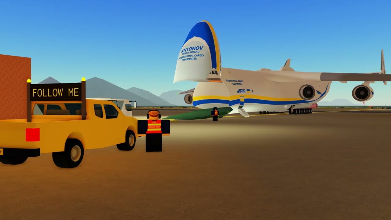 An Antonov cargo aircraft parked on an airport apron beside a yellow follow-me vehicle in Pilot Training Flight Simulator